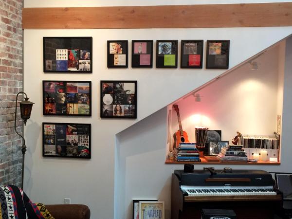 Wall of framed albums